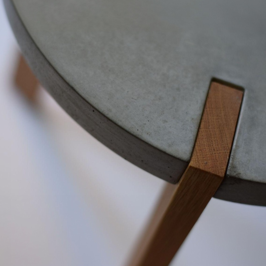 A minimal concrete and wood architectural joint detail