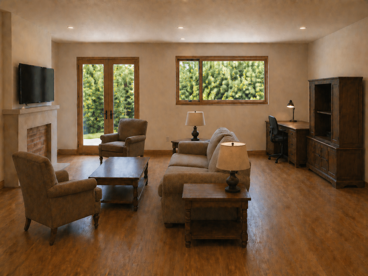 Existing living room before redesign — brown floors, brown furniture, TV anchoring nothing in particular